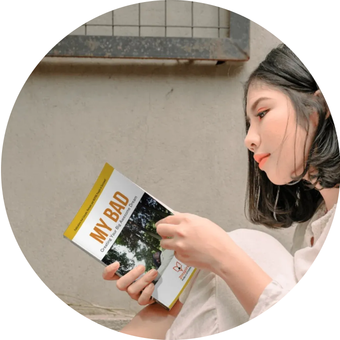 Young woman reading the ‘My Bad’ guide from 2Inspire Publications — focused on growth, self-awareness, and building real-world life skills.