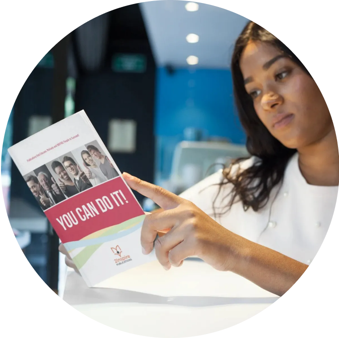 Focused young woman reading the ‘You Can Do It!’ guide by 2Inspire Publications — embracing mindset shifts and personal growth.